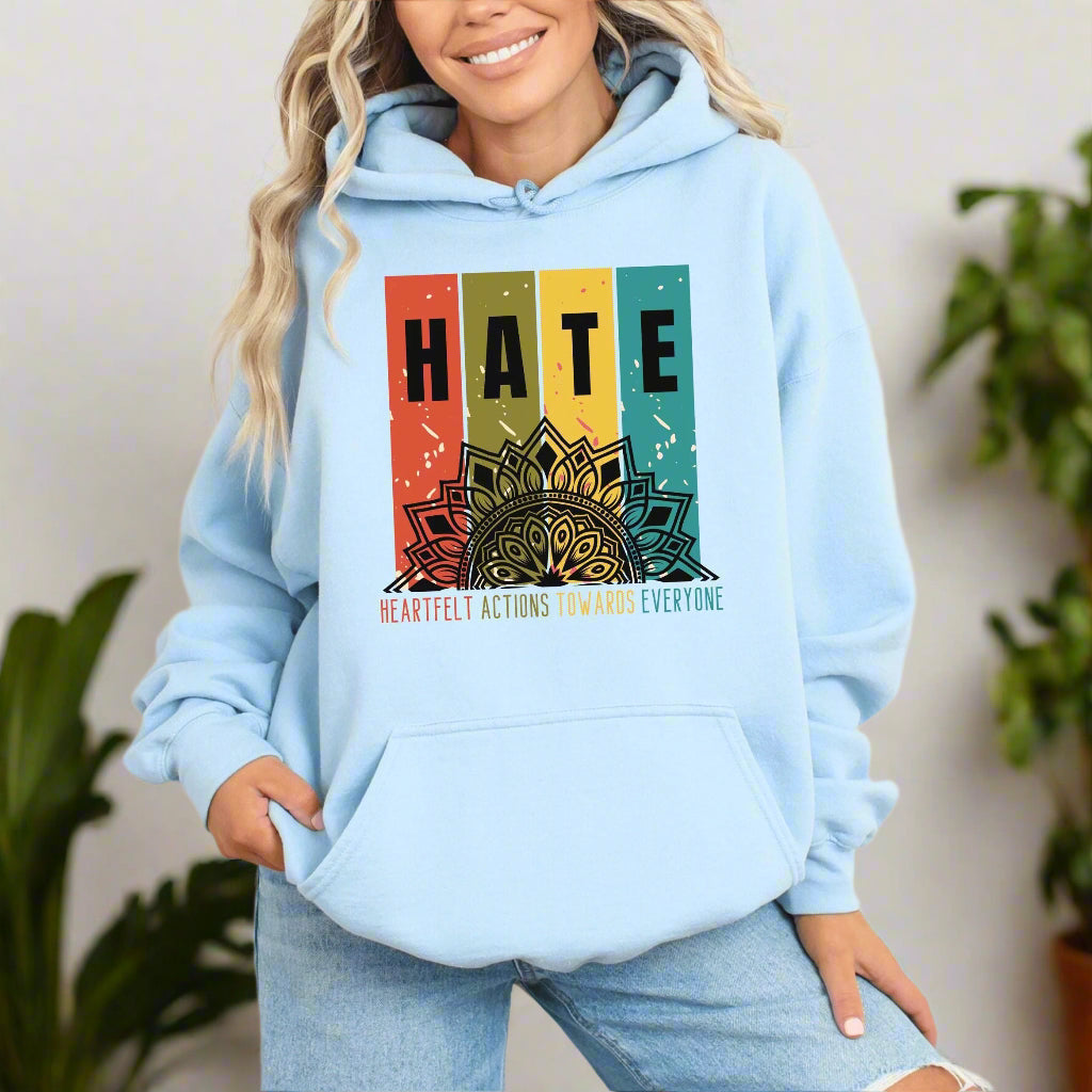 a woman wearing a blue hoodie with the words hate on it