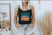 Thumbnail for a woman standing in a room with her hands in her pockets