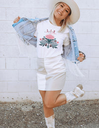 Thumbnail for a woman wearing a cowboy hat and a white shirt