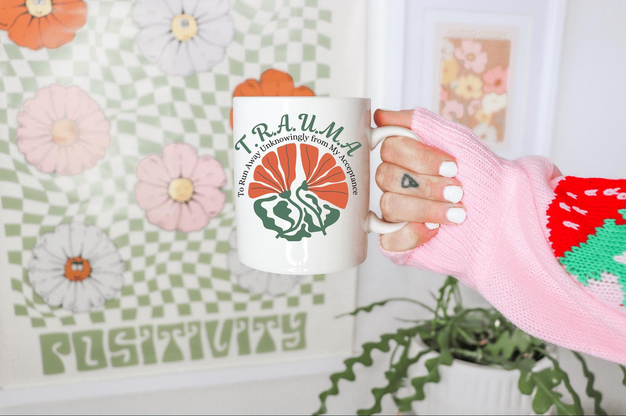 a person holding a coffee mug in their hand