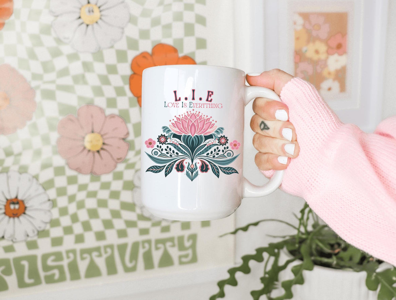 a person holding a coffee mug in their hand