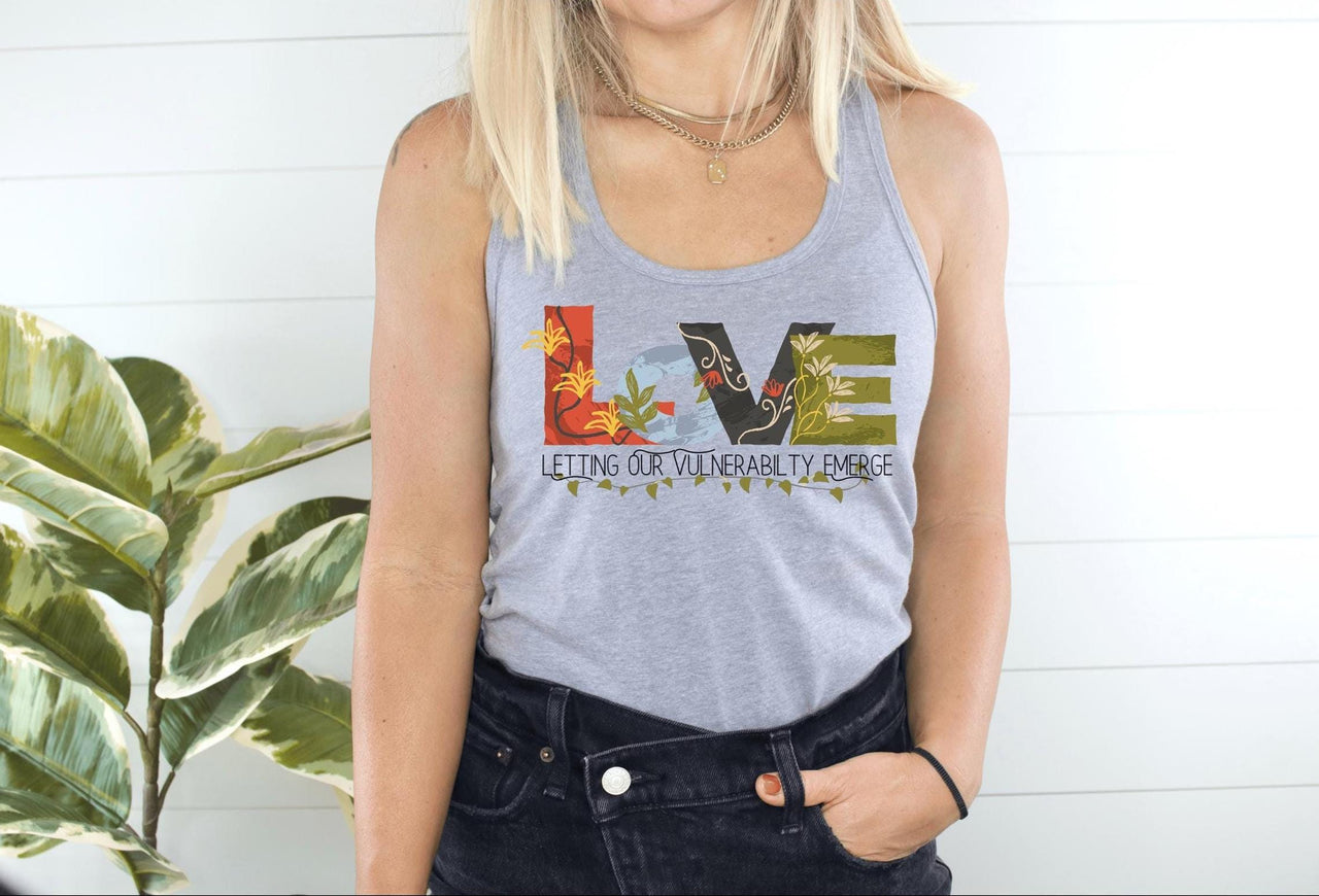 a woman wearing a tank top with the word love on it