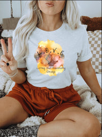 Thumbnail for a woman sitting on a bed holding a peace sign