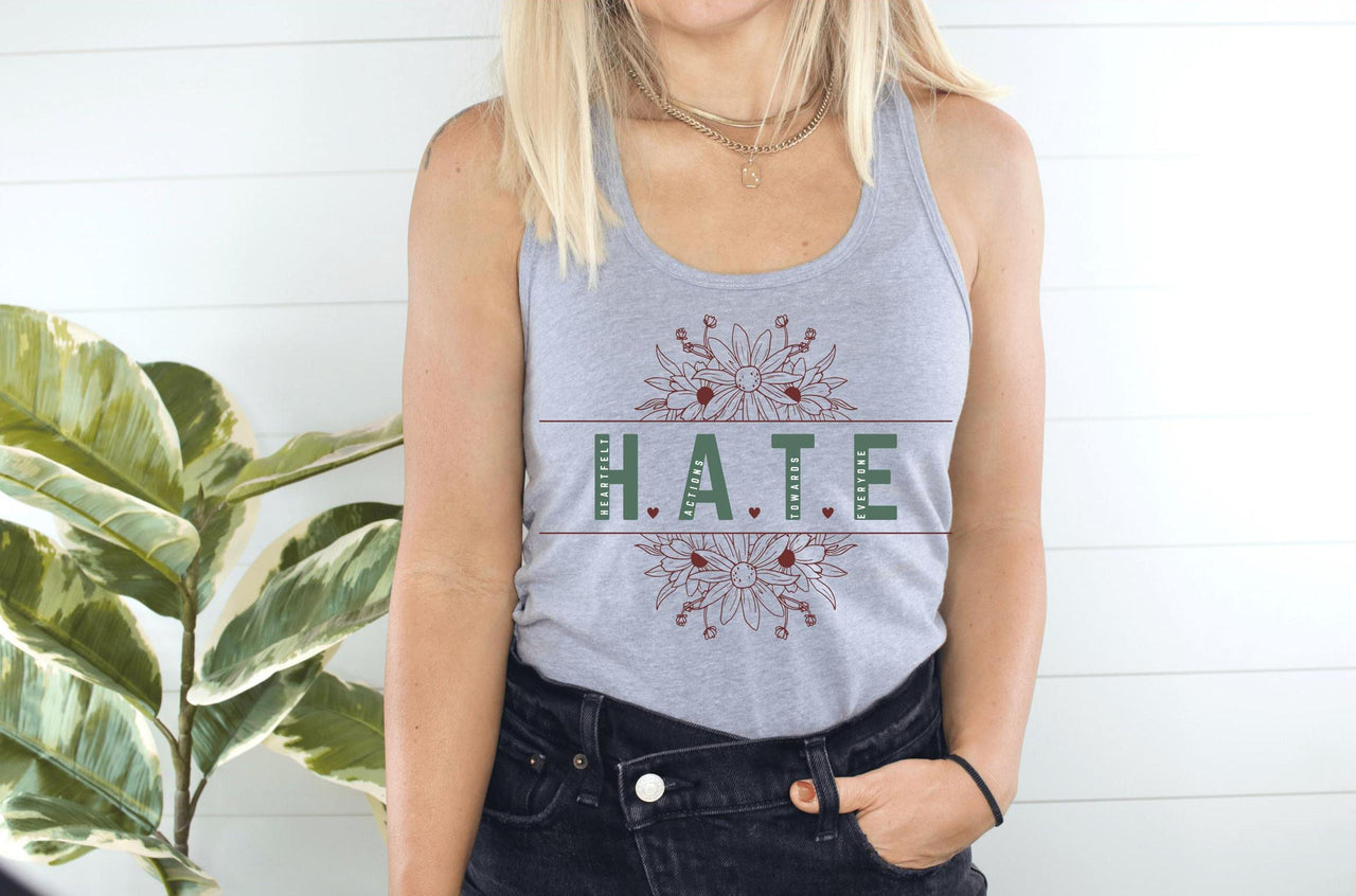 a woman wearing a tank top that says hate